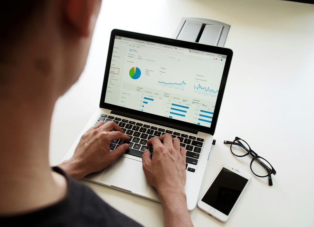 person using laptop for data analysis